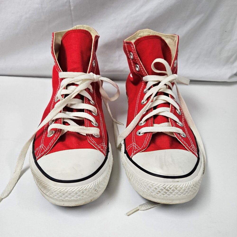 Unisex Red High-Top Converse All Star Chuck Taylor Sneakers. Retro cool vibe.